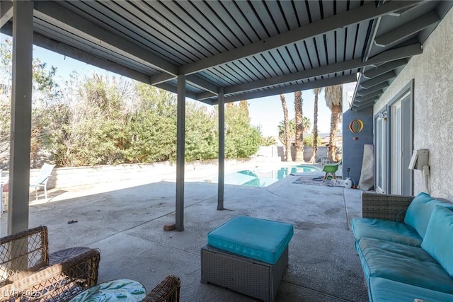 view of patio / terrace featuring outdoor lounge area and an outdoor pool