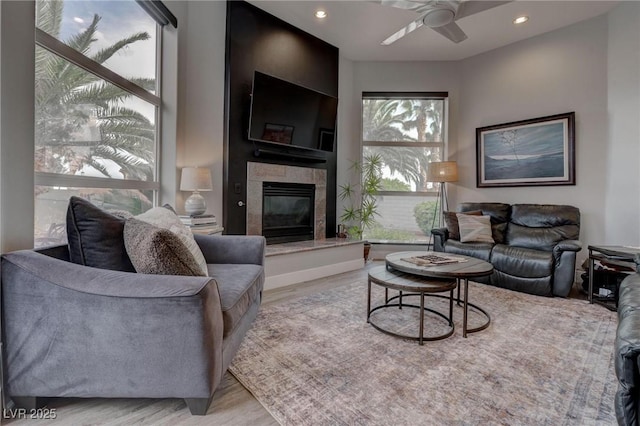 4594 Blue Mesa Way, Las Vegas, NV 89129 - living room with a glass covered fireplace, ceiling fan, recessed lighting, and wood finished floors