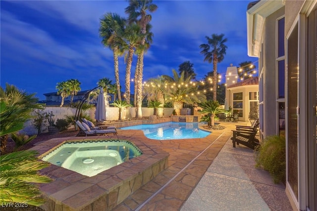 4594 Blue Mesa Way, Las Vegas, NV 89129 - pool at twilight with a patio, a fenced backyard, an in ground hot tub, and a fenced in pool