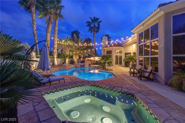 4594 Blue Mesa Way, Las Vegas, NV 89129 - pool at twilight featuring an in ground hot tub, an outdoor pool, and a patio area