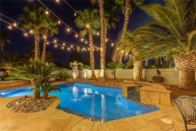4594 Blue Mesa Way, Las Vegas, NV 89129 - pool at twilight with a fenced in pool, fence, and a patio area