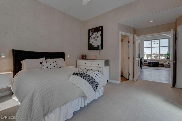 4594 Blue Mesa Way, Las Vegas, NV 89129 - bedroom with baseboards, ceiling fan, and light carpet