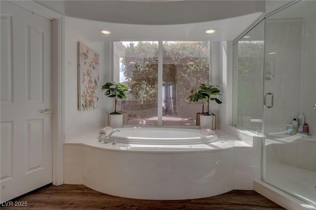 4594 Blue Mesa Way, Las Vegas, NV 89129 - full bathroom with a bath, wood finished floors, and a stall shower