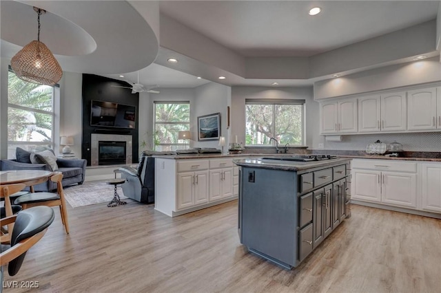 4594 Blue Mesa Way, Las Vegas, NV 89129 - kitchen with white cabinets, a kitchen island, and recessed lighting