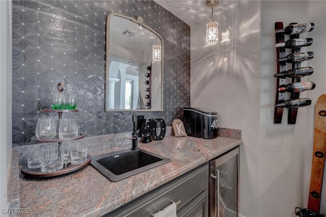 4594 Blue Mesa Way, Las Vegas, NV 89129 - bar featuring a sink, beverage cooler, wet bar, backsplash, and visible vents