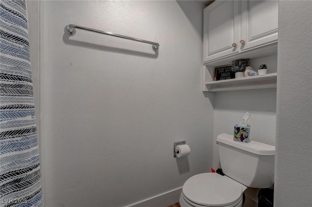 4594 Blue Mesa Way, Las Vegas, NV 89129 - bathroom featuring baseboards and toilet