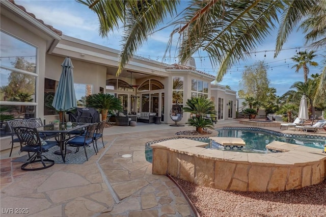 4594 Blue Mesa Way, Las Vegas, NV 89129 - pool with an outdoor hangout area, a jacuzzi, outdoor dining area, and a patio area