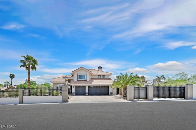view of front of home with driveway, a chimney, a fenced front yard, an attached garage, and stucco siding