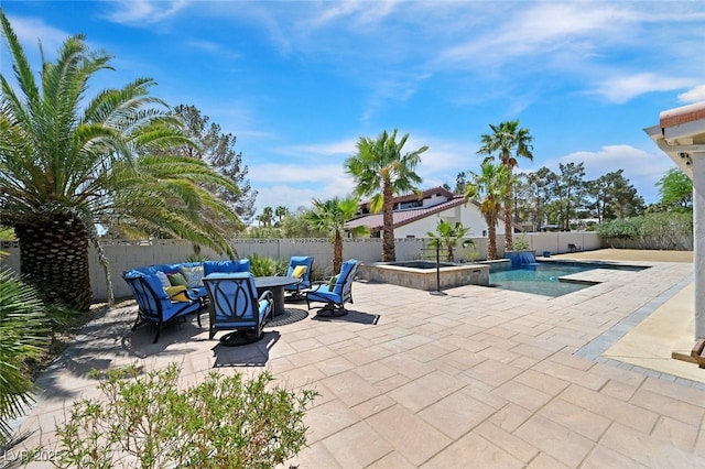 view of pool featuring a fenced backyard, a fenced in pool, a patio, and an in ground hot tub