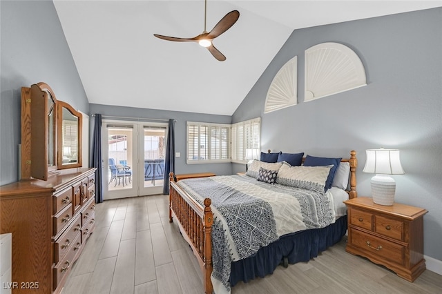 bedroom with access to outside, a ceiling fan, high vaulted ceiling, and french doors