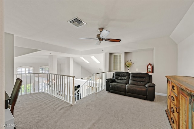 additional living space with visible vents, carpet flooring, and ceiling fan