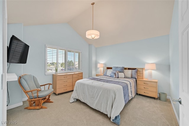bedroom featuring light colored carpet, baseboards, and lofted ceiling