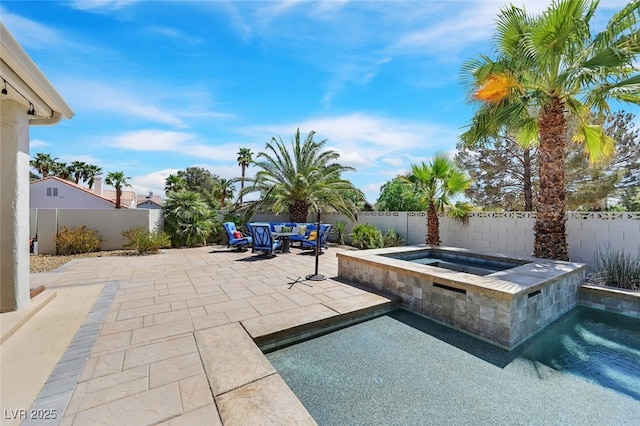 view of swimming pool with a fenced backyard, a fenced in pool, a patio, and an in ground hot tub