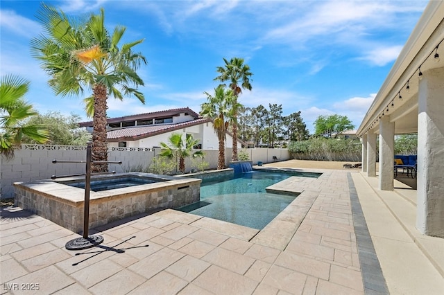 view of pool featuring a fenced backyard, a patio, and an in ground hot tub