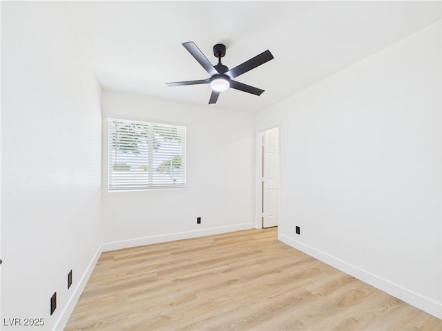 unfurnished room with a ceiling fan, baseboards, and light wood finished floors