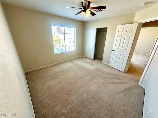 unfurnished bedroom featuring carpet floors, a ceiling fan, baseboards, visible vents, and a closet