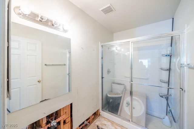 full bath with visible vents and a stall shower