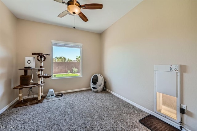 misc room featuring baseboards, ceiling fan, and carpet