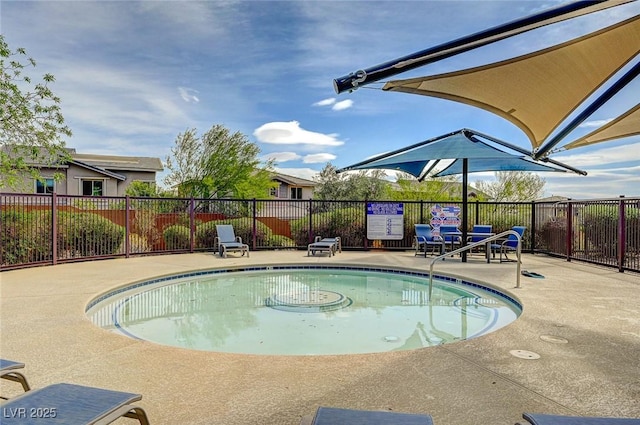 pool with fence and a patio area