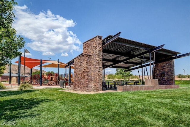 view of community with a lawn and playground community