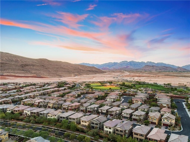 birds eye view of property featuring a mountain view and a residential view