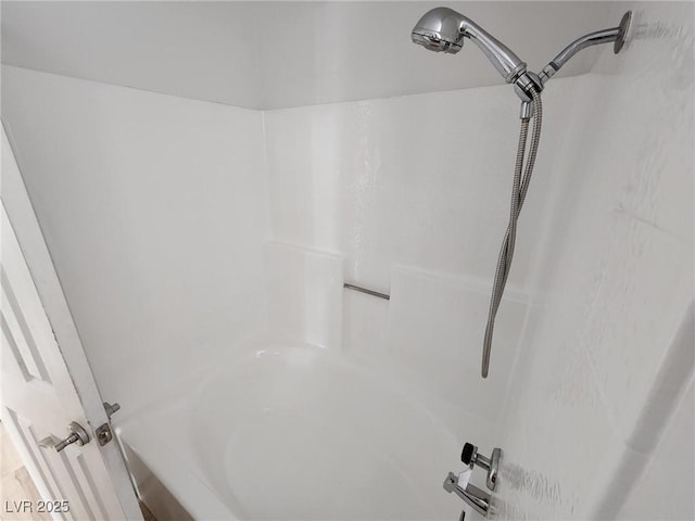 bathroom featuring a bathing tub and a shower