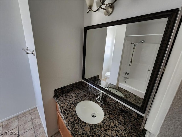 full bathroom with vanity, baseboards, toilet, and shower / tub combination