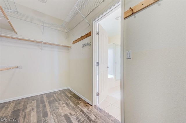 spacious closet with wood finished floors