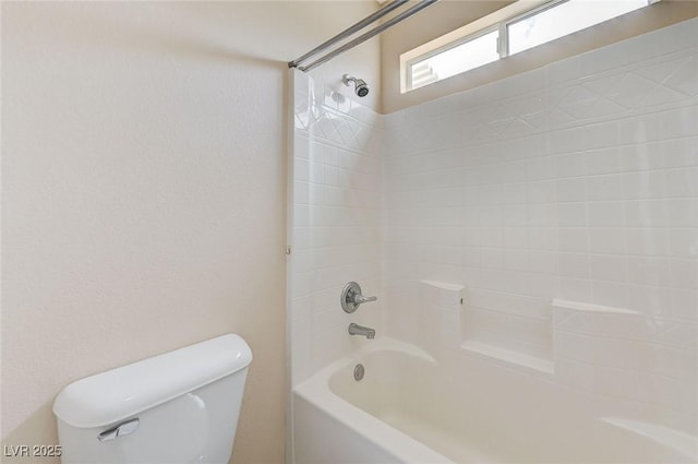 bathroom featuring  shower combination and toilet