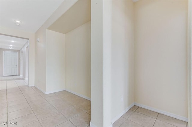 hall with recessed lighting, baseboards, and light tile patterned floors