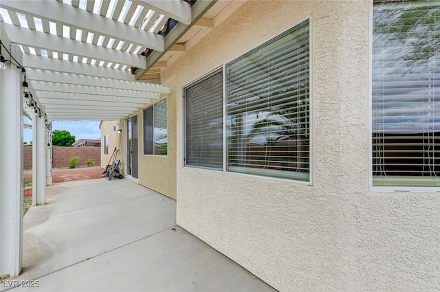 view of patio / terrace with fence and a pergola