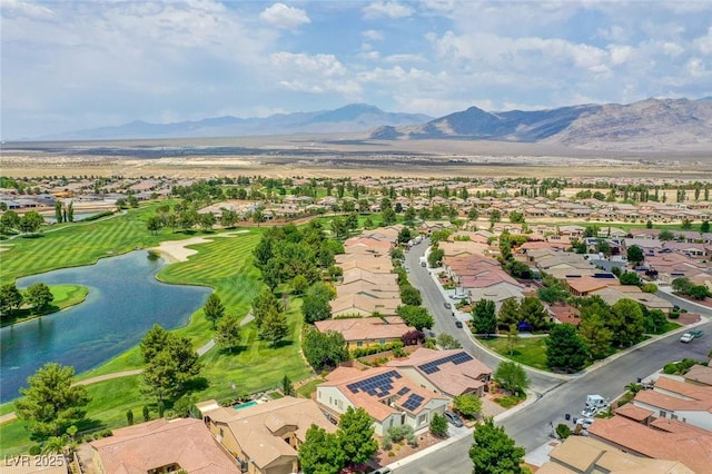 birds eye view of property featuring a water and mountain view and a residential view