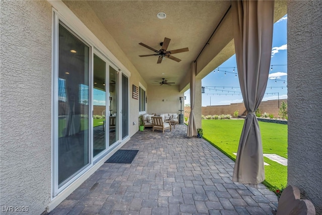 6325 Gambetta St, Las Vegas, NV 89115 - view of patio featuring a ceiling fan, outdoor lounge area, and fence