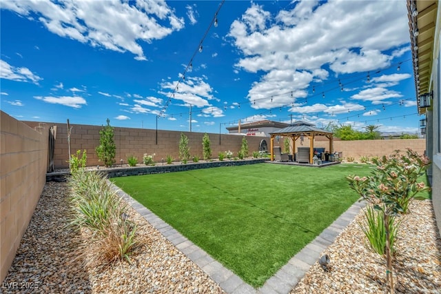 6325 Gambetta St, Las Vegas, NV 89115 - view of yard featuring a fenced backyard, a gazebo, and a patio area