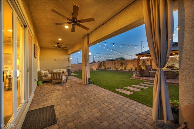 6325 Gambetta St, Las Vegas, NV 89115 - view of patio / terrace featuring a fenced backyard, a ceiling fan, a gazebo, and outdoor lounge area