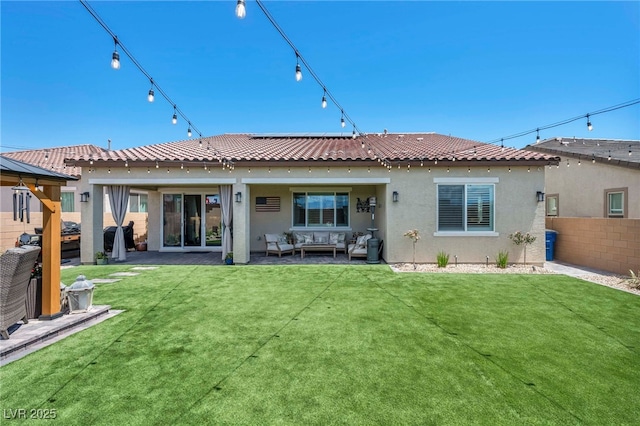 6325 Gambetta St, Las Vegas, NV 89115 - rear view of property featuring fence, stucco siding, an outdoor living space, and a tiled roof