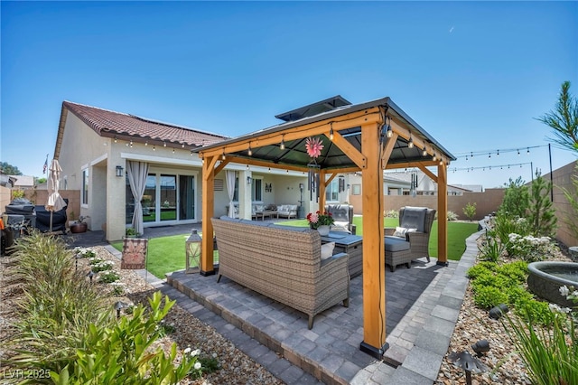 6325 Gambetta St, Las Vegas, NV 89115 - back of property with a fenced backyard, stucco siding, an outdoor hangout area, a patio area, and a gazebo