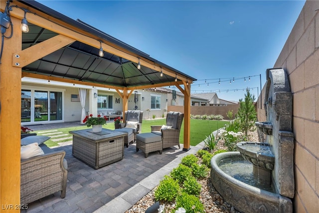 6325 Gambetta St, Las Vegas, NV 89115 - view of patio / terrace with fence, a gazebo, and an outdoor living space
