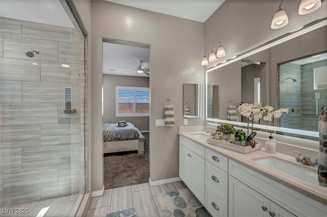 6325 Gambetta St, Las Vegas, NV 89115 - bathroom featuring a sink, ceiling fan, double vanity, and tiled shower