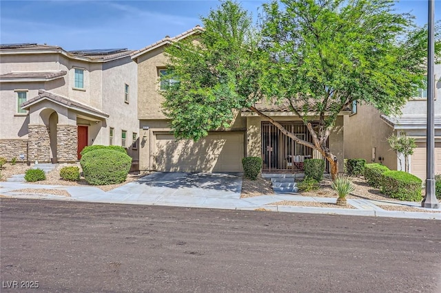 8091 Mosaic Sunrise Ln, Las Vegas, NV 89166 - view of front of house with concrete driveway, a garage, and stucco siding