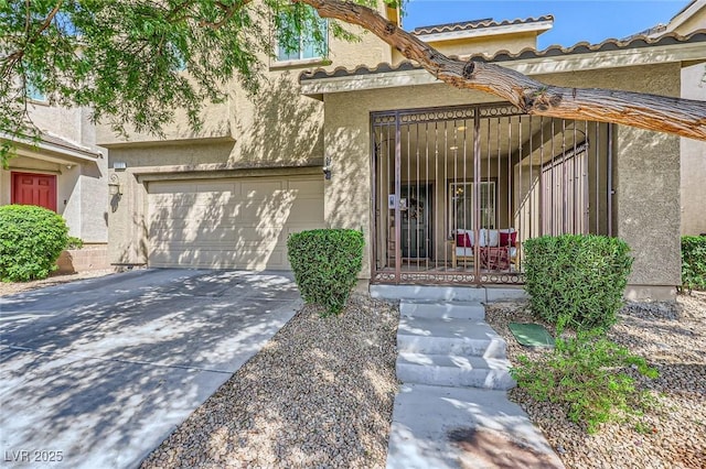 8091 Mosaic Sunrise Ln, Las Vegas, NV 89166 - property entrance featuring driveway, stucco siding, and a porch