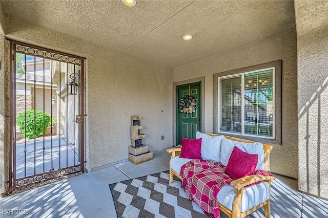 8091 Mosaic Sunrise Ln, Las Vegas, NV 89166 - entrance to property with stucco siding and a porch