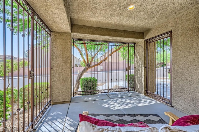 8091 Mosaic Sunrise Ln, Las Vegas, NV 89166 - doorway to outside with concrete floors