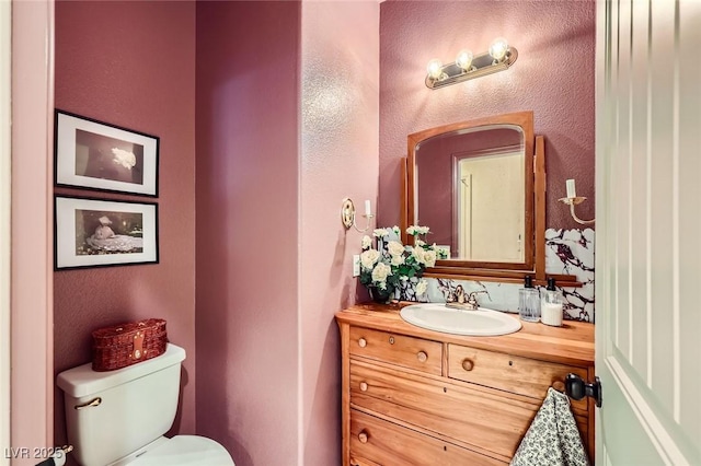 8091 Mosaic Sunrise Ln, Las Vegas, NV 89166 - bathroom featuring vanity and a textured wall