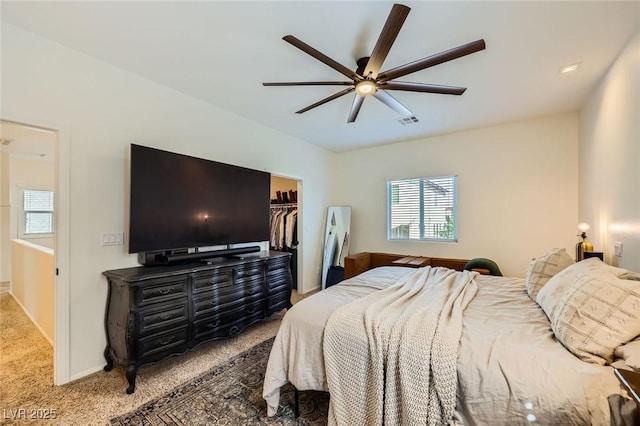 8091 Mosaic Sunrise Ln, Las Vegas, NV 89166 - bedroom featuring carpet, multiple windows, a walk in closet, and a ceiling fan