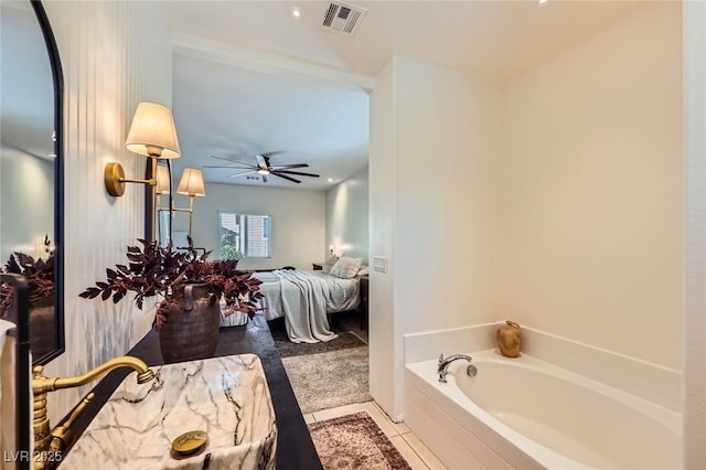 8091 Mosaic Sunrise Ln, Las Vegas, NV 89166 - ensuite bathroom with a bath, tile patterned floors, and a ceiling fan