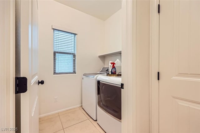 8091 Mosaic Sunrise Ln, Las Vegas, NV 89166 - laundry area with washer and clothes dryer and light tile patterned flooring