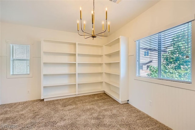 8091 Mosaic Sunrise Ln, Las Vegas, NV 89166 - spare room featuring a chandelier and light carpet