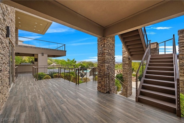 wooden terrace featuring stairs
