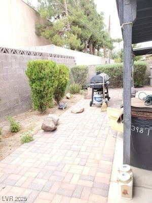 view of patio / terrace with a fenced backyard and area for grilling